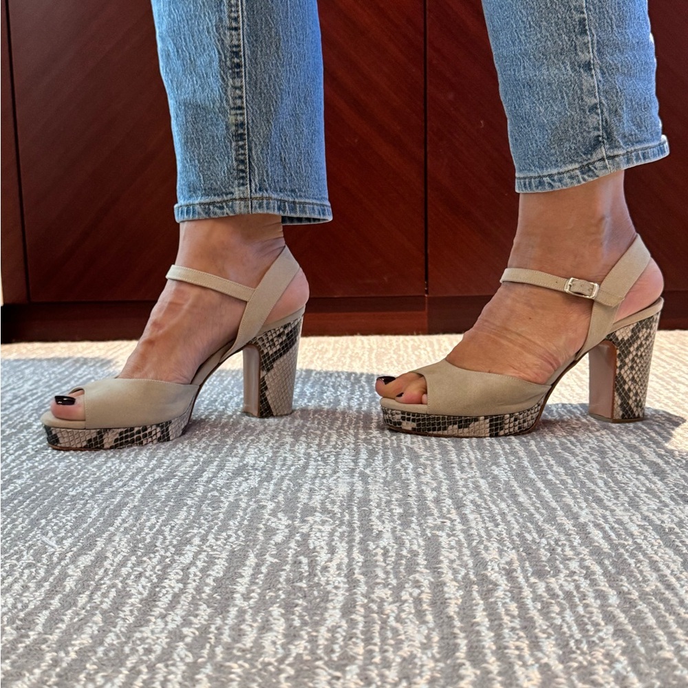 Beautiful block heels with snake print on heel and soles.